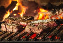 What is the difference between grilling and barbecuing